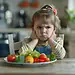 Niña enojada con verduras en la mesa, comida saludable, actitud molesta, niño pequeño con expresiones de irritación en cocina.