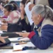Personas entregando documentos en módulos del IVEM para viviendas del Bienestar en Michoacán