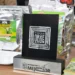 Compact display of organic products from Michoacán, including packaged herbs, natural sweeteners, and health supplements.