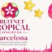 Imagen de frutas tropicales y el logo del Congreso en Barcelona.