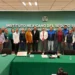 Grupo de profesionales y funcionarios en una reunión en la oficina del IMSS en Michoacán.
