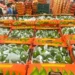 Cajas de limones veracruzanos en un mercado, listos para exportación internacional.